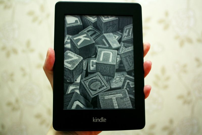 Holding a Kindle Paperwhite