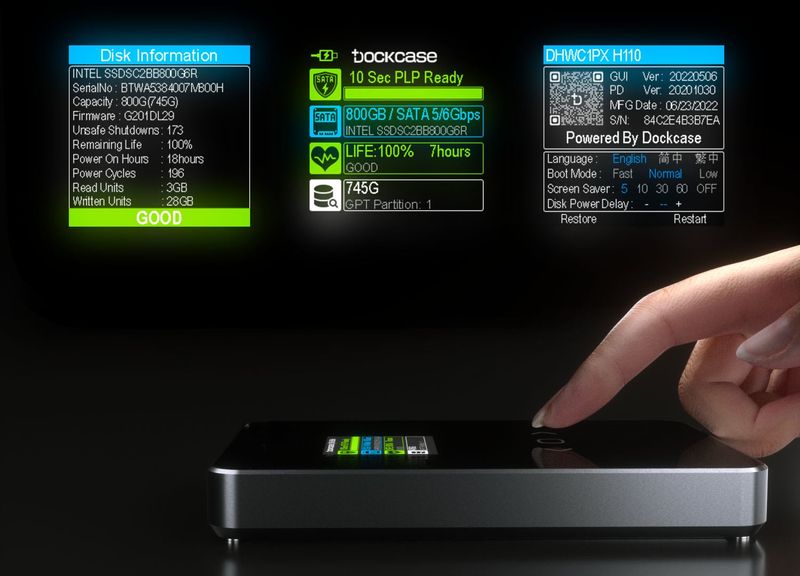 Finger touching the display of the Dockcase external storage enclosure, with various status information shown