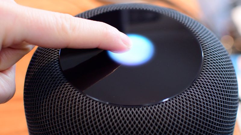 Touching the top touch sensor of HomePod with one finger
