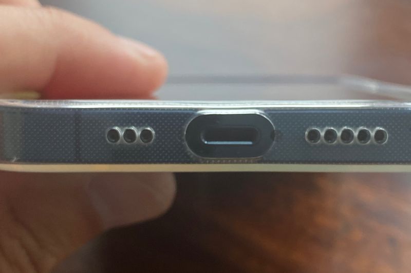 An image showing a charging port cutout closeup on a minimalist iPhone 13 case from Totallee