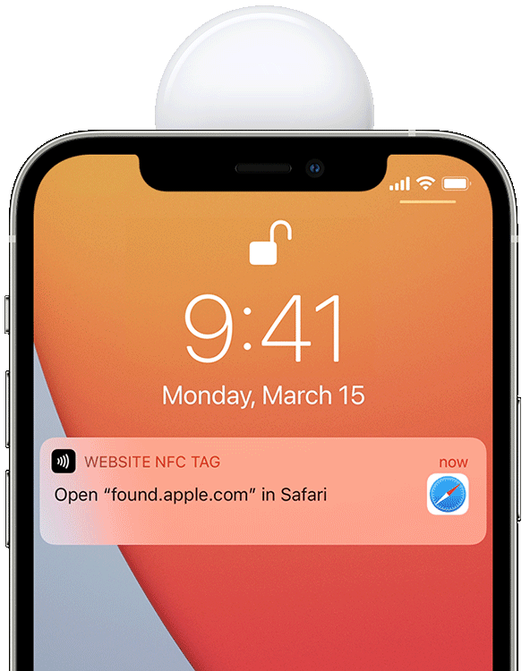 An image showing the white side of an Apple AirTag held to the top of an iPhone 12 with Safari