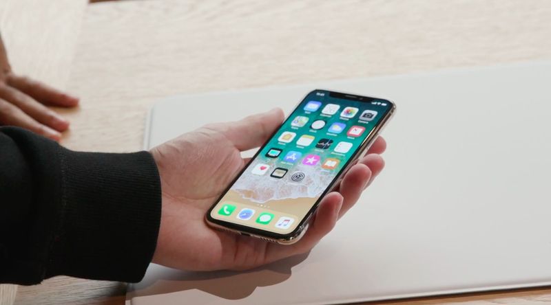 Holding iPhone X