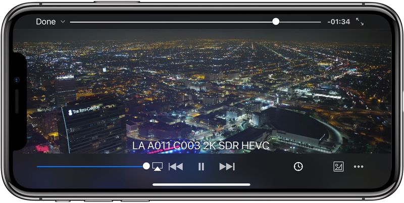 A screenshot showing the VLC media player running in fullscreen mode on an iPhone X with the media controls shown