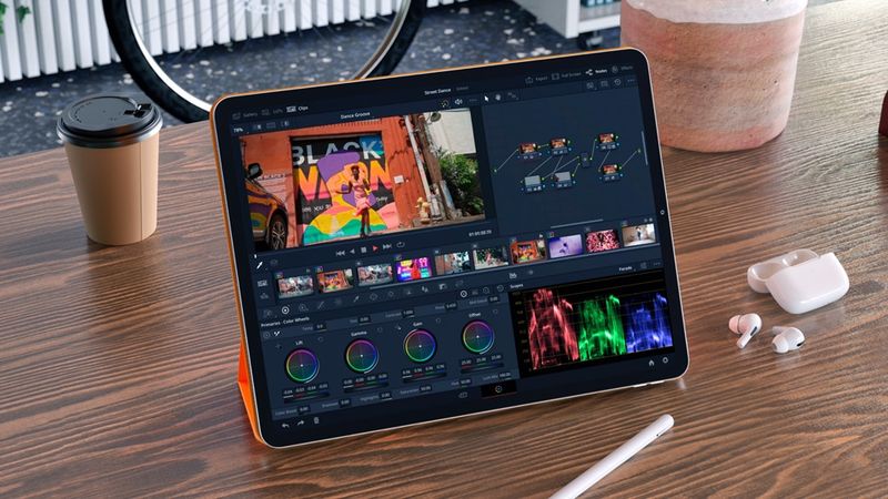 DaVinci Resolve running on an M2 iPad Pro sitting on a table alongside an Apple Pencil and a pair of AirPods Pro