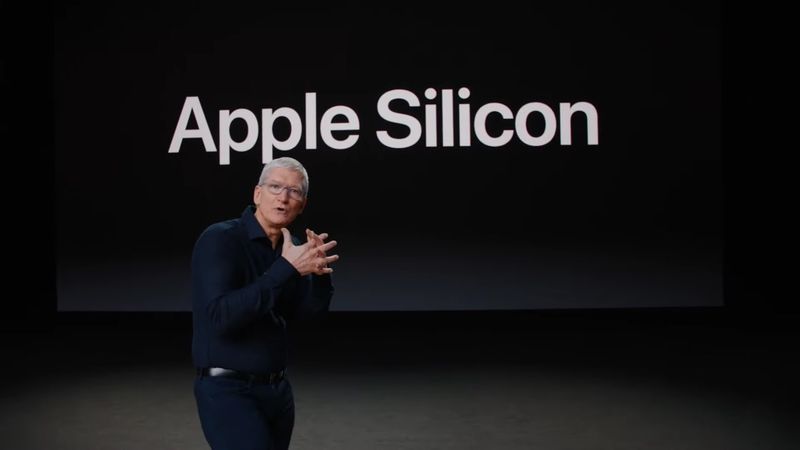 A photo of Apple CEO Tim Cook set against a background slide with the words