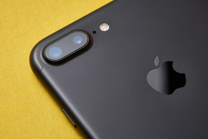 A closeup of a matte black iPhone 7 Plus showing the rear dual-lens camera and LED flash detail