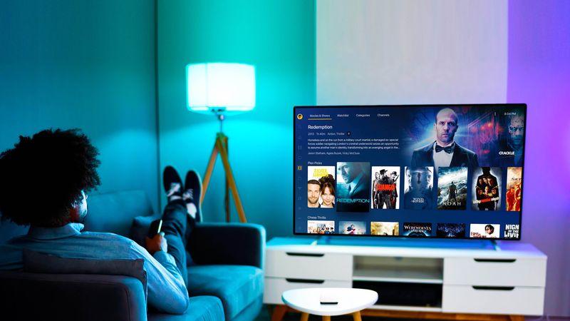 A lifestyle photograph from Plex showing the modern layout on Roku