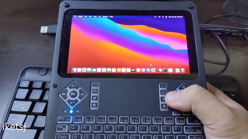 A still from a YouTube video showing a DIY handheld computer running Apple