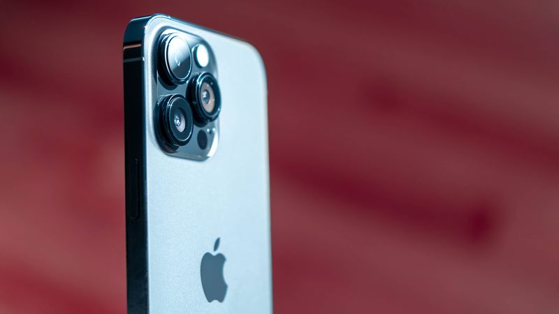 iPhone 14 Pro Max standing upright, showing off its rear cameras