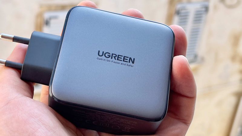 A male hand holding Ugreen